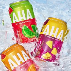 three cans of aha sparkling water on ice