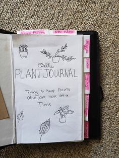 a piece of paper with writing on it next to a clipboard that says plant journal