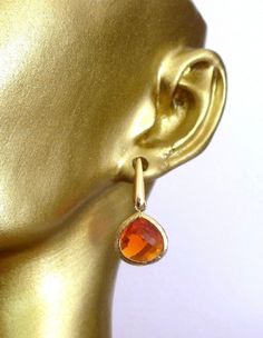 Beautiful Orange and 16k Gold Earrings Small dangle earrings on gold post Almost 1 inches  long.  If you have any questions, please feel free to message us!  All monitors display color differently; please takes this into consideration when placing your order If this is a gift and you need a note, please add so in the "notes" section when checking out. Gold Teardrop Linear Earrings As Gift, Orange Drop Earrings For Anniversary, Gold Long Drop Crystal Earrings, Gold Crystal Ear Wire Earrings For Formal Occasions, Gold Crystal Earrings With Ear Wire For Formal Events, Gold Crystal Earrings With Ear Wire For Formal Occasions, Gold Nickel-free Teardrop Earrings For Anniversary, Gold Teardrop Long Drop Earrings For Anniversary, Gold Hypoallergenic Drop Crystal Earrings