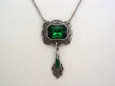 "Vintage German Glass Emerald Green Octagon Victorian Drop Necklace Oxidized Silver Finish German Setting Drop Necklace Split Chain Setting - made in Germany, measures 31x27mm Cabochon - 1/2\" x 3/4\", vintage German glass Drop - 2 1/2\" (64mm) Chain - figaro style, 20\" For matching earrings: https://www.etsy.com/listing/593604626/emerald-green-victorian-glass-oxidized For complete set price: https://www.etsy.com/listing/593606528/emerald-green-victorian-oxidized-finish As with any vintage cabo Victorian Style Jewelry, Emerald Green Necklace, Victorian Pendants, Filigree Necklaces, Vintage Style Jewellery, Emerald Necklace, Victorian Jewelry, Green Necklace, Drop Necklace