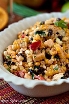 a white bowl filled with corn and black beans