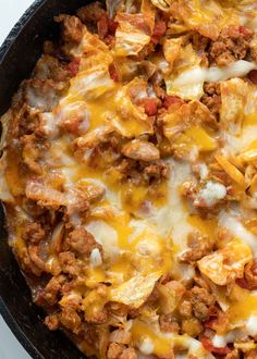 a skillet filled with meat and cheese