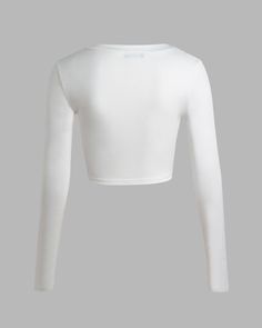 Details: Long-sleeve top with front star graphical designTop Length: CroppedSleeve Length: Long SleevesMaterials:35% Cotton + 60% Polyester + 5% Spandex High Stretch White Crop Top, White Long Sleeve Crop Top With Graphic Print, Fitted Long Sleeve Crop Top With Graphic Print, White Fitted Long Sleeve Crew Neck Top, White High Stretch Long Sleeve Top, High Stretch Long Sleeve Top With Graphic Print, High Stretch White Tops For Fall, Trendy White Fitted Long Sleeve Top, White Fitted Long Sleeve Top, Trendy Style