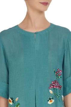 In a refreshing teal blue shade, this kurta features floral fine thread embroidery created by hand and machine. Perfect for summer festive events and more. 
Flared kurta
Machine and hand embroidery in thread and beads
Round neckline
Short sleeves
 - Aza Fashions Blue Resham Embroidery Kurta For Summer, Summer Blue Kurta With Resham Embroidery, Green Floral Embroidered Straight Kurta, Blue Embroidered Straight Kurta Top, Spring Straight Kurta Top With Embroidered Neckline, Summer Blue Kurta With Embroidered Neckline, Blue Summer Kurta With Embroidered Neckline, Spring Blue Chikankari Embroidered Kurta, Floral Embroidered Straight Kurta Top For Summer