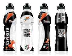 three bottles of energy drink with orange and black designs on the front, one is white and