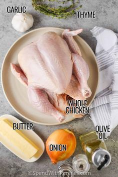 the ingredients to make a whole chicken on a plate