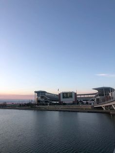 a large body of water next to a building