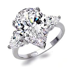 an engagement ring with three pear shaped diamonds