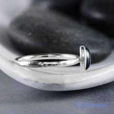 This Dainty Sterling Silver Oval Promise Ring features an 8 x 6 mm Blue Sapphire cabochon that has been securely set in a highly polished fine silver bezel. The band is made of a sturdy round Silver wire that has been given a hammer texture. To the ancient world, Blue Sapphire signified hope and faith and was believed to bring protection, fortune and insight. Includes Sterling Silver Handmade Stacking Ring, 8 x 6 mm Cabochon Stones Dimensions: Stacking Ring: 5 mm high, 9 mm at widest point, band Oval Promise Ring, Blue Sapphire Promise Ring, Sapphire Promise Rings, Unique Promise Rings, Oval Sapphire Ring, Sapphire Cabochon, September Birthstone Rings, Ancient World, Blue Sapphire Ring