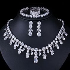 Elevate your prom look with this fashion bridal necklace set. The set includes a stunning necklace and matching accessories, adding a touch of elegance and sophistication to your ensemble.
– This bridal a plus cubic zirconia gemstone necklace set is perfect for adding elegance to any bridal ensemble.– Made with high-quality materials, this set includes a stunning necklace and matching earrings for a complete look.– Perfect for pageant, bridal, bridesmaid, prom, quinceañera or special occasion. Prom Jewelry Sets, Crystal Bridal Jewelry Sets, Bracelet And Ring, Zircon Necklace, Bridal Necklace Set, Silver Necklace Set, Bridal Jewelry Set, Prom Jewelry, Dangle Necklaces