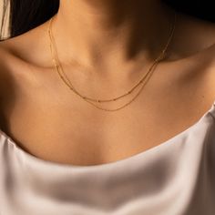 B E A D E D ∙ D U O ∙ C H A I N ∙ N E C K L A C E Get two in one with our minimalist Beaded Duo Chain necklace. With one satellite chain and one dainty chain layered together, this choker necklace gives the illusion that you put in the extra effort when you really spent the extra time in bed. * Material: High Quality Solid 925 Sterling Silver * Finish: Sterling Silver ∙ 18K Gold * Featuring a Minimalist Chain layered with a Dainty Beaded Chain, adjustable length 16 inches to 18 inches. H O W ∙ T Minimalist Layered Necklace With Satellite Chain, Minimalist Everyday Layered Chain Necklace, Minimalist Double Strand Layered Necklace, Minimalist Double Strand Layered Necklace With Adjustable Chain, Minimalist Double Strand Clavicle Chain Layered Necklace, Minimalist Beaded Chain Layered Necklace, Minimalist Double Chain Layered Necklace For Everyday, Minimalist Double Chain Necklace, Minimalist Everyday Beaded Chain Layered Necklace