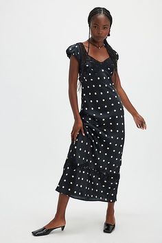 Perfect in polka dot, this stunning maxi dress is featured in a classic, A-line silhouette with butterfly lace-adorned neckline and slightly puffed capped sleeves for an added timeless touch. **Fit:** Staple, A-line fit **Features:** V-neckline, butterfly lace mesh at bust & hem, bias-inspired fit, exposed back detail, defined cap sleeves, keyhole back feature **Why We | Butterfly Babe Maxi Dress by Free People in Black, Size: XL Fitted Polka Dot Maxi Dress, Elegant Polka Dot Dress With Square Neck, Fitted Polka Dot Ruffled Maxi Dress, Fitted Polka Dot Maxi Dress With Ruffles, Elegant Polka Dot Maxi Dress With Ruffles, Elegant Short Sleeve Polka Dot Midi Dress, Chic Polka Dot Dresses With Lace Trim, Elegant Polka Dot Maxi Dress With Short Sleeves, Fitted Polka Dot Dress With Lace Trim