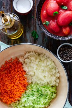 the ingredients for this dish include onions, celery, and carrots in bowls