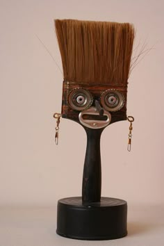 a close up of a brush with a face on it