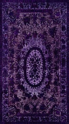 a purple rug with an intricate design on it