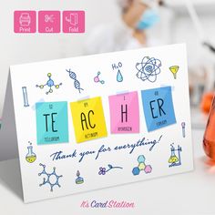 a card with the word teacher written on it next to an orange beakle filled with liquid