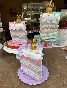 there are three pieces of birthday cake on the counter top, and one slice has been decorated with sprinkles