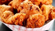 some fried food in a basket on a table