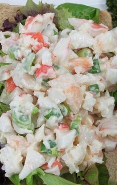 a close up of a plate of food with lettuce and chicken salad on it