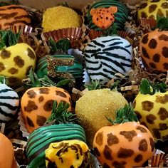 a box filled with lots of different types of chocolate covered strawberries on top of each other