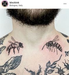 a man with tattoos on his chest has two bees and leaves tattooed on his chest