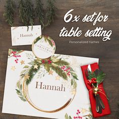 a table setting with place cards, napkins and silverware on top of it