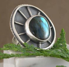 "Sterling Silver One Of a Kind Ring Handmade by Michelle Zjala Winter Myska Jewelry At the center of this ring is an amazingly beautiful Labradorite with lots of color and flash. The length of the top is just over 1 1/2\" and 1 1/4\" wide. This beauty is a size 8, but is adjustable from 7 1/2 to a 9 1/2. Adjusted at time of order, not meant to be adjusted more that a few times.   Handmade in beautiful Wisconsin, by Metalsmith Michelle Zjala Winter at Myska Jewelry (Myska, polish name for mouse, my Mom's nickname for me) Follow pics and inspiration on Instagram #MyskaJewelry Portfolio: MichelleZjalaWinter.weebly.com" Adjustable Rings Silver, Silver Gift Wrap, Metalwork Jewelry, Labradorite Jewelry, Labradorite Ring, Handmade Rings, Silver Rings Handmade, Gothic Jewelry, Contemporary Jewelry