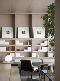 a chair and table in a room with bookshelves