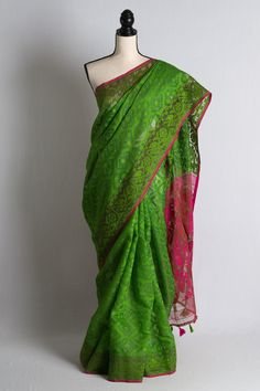 Introducing our stunning Minakari Soft Jamdani Saree in Parrot Green and Hot Pink, the perfect addition to your saree collection. This saree features intricate minakari work, adding a touch of elegance to its already beautiful design. The soft jamdani material provides a comfortable and breathable wear, making it perfect for any occasion. The vibrant parrot green and hot pink colors are sure to make a statement and turn heads. Shop now and add this must-have piece to your wardrobe. Color : Parro Green Slub Silk Pre-draped Saree, Designer Green Saree For Transitional Season, Designer Transitional Green Saree, Festive Green Handloom Pre-draped Saree, Green Bollywood Style Saree In Slub Silk, Green Bollywood Slub Silk Saree, Green Slub Silk Bollywood Saree, Designer Green Slub Silk Saree, Elegant Green Cotton Silk Saree