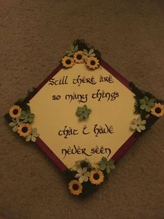 a graduation cap decorated with flowers and words