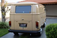 an old van parked in front of a house