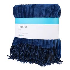 the blue throw is folded on top of each other