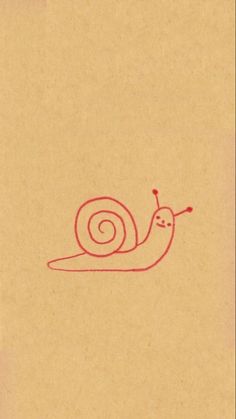 a drawing of a snail on top of a piece of brown paper with red ink