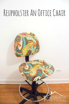 an office chair with a colorful paisley print upholstered on it's back