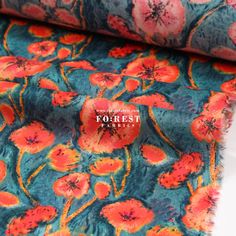 an orange and blue floral print fabric with the word yokest printed on it