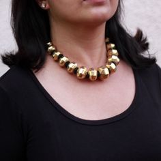 Chunky and versatile round dholki bead necklace. Beads are made of wax and coated with silver foil. This is further polished with gold. Play it up! Western or ethnic will surely add statement! Its a graduated bead necklace with biggest bead in the center. Length of beads only is 30 cm. There is adjustable thread closure at back. Biggest bead is about 2.75 cm wide. Dimensions: Length : 30 cm (beads) Width :  2.75 cm  (biggest bead dia) Weight : 120 gm Please feel free to email with any other ques Gold Jewelry With Polished Metal Beads, Silver Beaded Necklace With Gold Beads For Festivals, Festival Silver Beaded Necklace With Gold Beads, Gold Beaded Necklaces With Silver Beads For Celebration, Gold Beaded Necklace With Silver Beads For Celebration, Festive Round Large Beads Jewelry, Gold Beaded Necklaces With Silver Beads For Festivals, Large Round Beads Jewelry For Festivals, Festival Jewelry With Large Beads