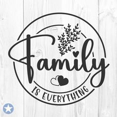 the word family is everything on a wooden background with an image of leaves and hearts