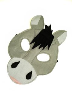 an animal mask with black and white hair