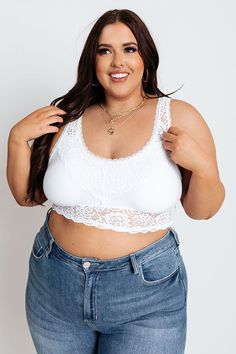 Plus Size - Add a flirty layer and additional coverage to any look with our femme white 'Love In Lace Bralette' featuring gorgeous lace detailing, a scooped neckline, wide shoulder straps with a deep v-cut neckline, and a flattering silhouette that ends in a straight hemline! This bralette comes with removable padding. Measurements XL variant has a Int Cup of A-D", a Int Width of 36-38". 2XL variant has a Int Cup of B-DD", a Int Width of 38-40". White Lace Patchwork Camisole Tank Top, Feminine White Lace Tank Top, White Stretch Lace Top, White Lace Bodice Camisole Top, White Feminine Tank Top With Delicate Lace, White Lace Camisole Top, Fitted White Tank Top With Delicate Lace, White Scoop Neck Camisole, Bra Friendly, White Lace Top Stretch Camisole