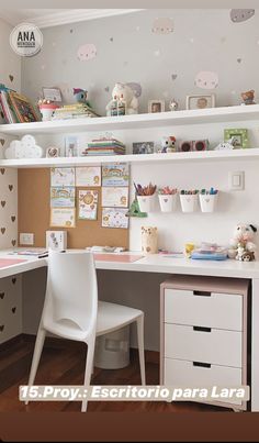 a child's desk with white chairs and shelves