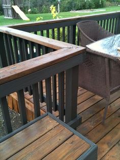 an outdoor table and chairs on a wooden deck