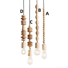 three light bulbs hanging from the ceiling with different types of wooden beads attached to them