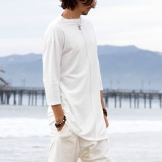 This super comfy white loose top is a great option for your favorite lounge wear, or a yoga or meditation shirt. It has a nice edgy urban look and it can be worn in the city, as a part of a sound bath or a Ceremony journey, or as a nice Jedi or Nomad style festival outfit. Try it with our glorka harem pants - they go so well together! Materials: stretch cotton jersey. Fabric for this pair was bought in Fashion District in LA and the pant was handmade in one of our Manhattan studios in NYC. Measu Resort Loungewear, Boho Lounge, Urban Zen, Mens Top, Buddhist Practices, Upcycled Fabric, Festival T Shirts, Yoga Shirt, Fashion District