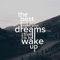 the best way to make your dreams true is to wake up quote on mountain background