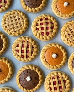 many pies and cookies are arranged on a table