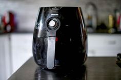 a black blender sitting on top of a counter