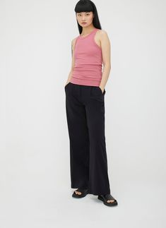 A slim-fit ribbed tank top with a flattering shape, designed for easy warm-weather layering. With a high-neck and ultra-soft ribbed modal cotton fabric, this comfortable wardrobe staple has an added back panel that highlights your shape. Solid Stretch Tank Top For Work, Casual Tank Top For Yoga, Casual Yoga Tank Top, High Stretch Versatile Tank Top For Spring, Versatile Tank Top, Spring Yoga Tank Top With Elastane, Chic Yoga Tank Top For Spring, Chic Spring Yoga Tank Top, Versatile High Stretch Everyday Tank Top