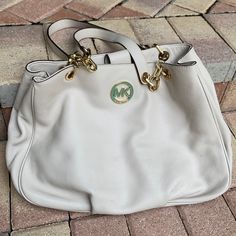 Cream Michael Kors Shoulder Bag With Gold Mk Emblem. Tiny Blue Mark On The Side Of The Bag Shown In Photo. On The Inside Of The Bag Shown In The Photo There’s A Brown Stain In One Of The Pocket In Photo As Well Other Than That It Looks Brand New Barely Used. Smoke-Free Pet Free Home Beige Everyday Shoulder Bag With Logo Hardware, Beige Tote Bag With Logo Hardware, Everyday Beige Shoulder Bag With Logo Hardware, Beige Bags With Logo Hardware For Everyday Use, Beige Tote Shoulder Bag With Logo Hardware, Everyday Michael Kors Bag With Logo Hardware, Michael Kors Everyday Bag With Logo Hardware, Michael Kors Shoulder Bag With Logo Hardware, Cheetah Purse