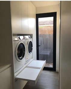 a washer and dryer in a small room