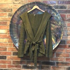 Size S/P Olive Green Hooded Cardigan. Brand New Without Tags But The Left Belt Loop Is Not Attached, Otherwise In Excellent Condition. Fabric: 60% Cotton, 40% Acrylic Hand Wash Hooded Green Cardigan For Fall, Olive Long Sleeve Winter Cardigan, Olive Long Sleeve Cardigan For Winter, Green Hooded Cardigan For Fall, Tie Cardigan, Hooded Cardigan, Free People Sweaters, Free People Sweater, Olive Green